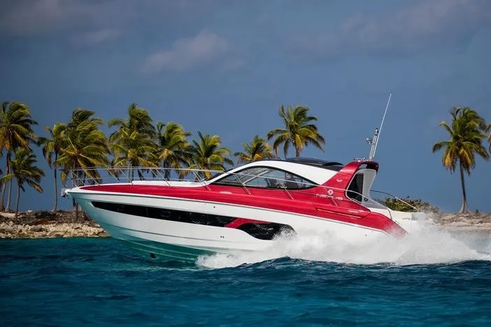  Yacht Photos Pics Azimut Nexus X47 yacht cruising near tropical island, 2020 model, vibrant red and white design.
