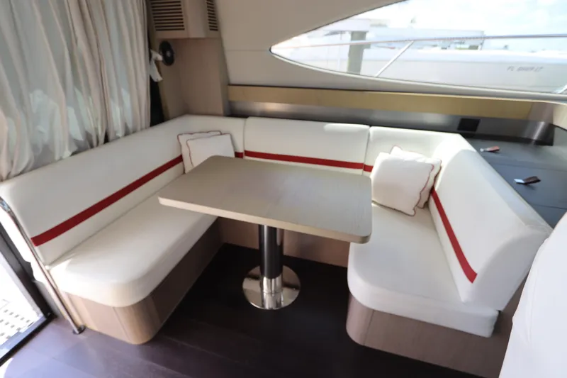  Yacht Photos Pics Luxurious interior of 2020 Azimut Nexus X47 yacht with elegant seating and table.