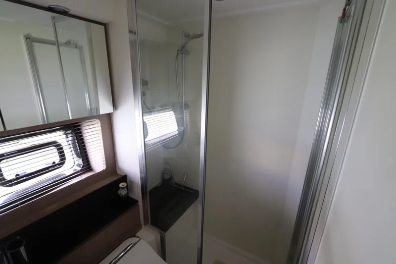  Yacht Photos Pics Modern bathroom interior on 2020 Azimut Nexus X47 yacht, featuring shower and window.
