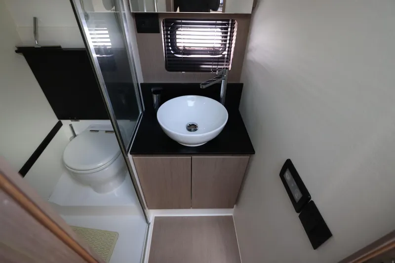  Yacht Photos Pics Modern bathroom in 2020 Azimut Nexus X47 yacht with sleek sink and toilet.