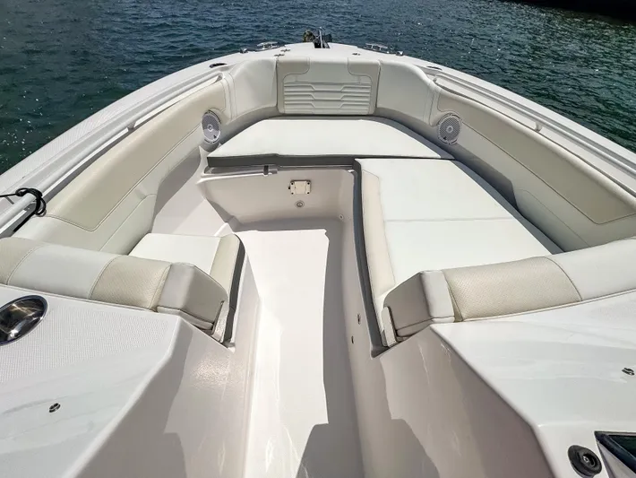  Yacht Photos Pics 2025 Edgewater 262 CX boat interior with white seating and open water view.