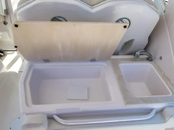  Yacht Photos Pics 2025 Edgewater 262 CX boat interior with open storage compartments.