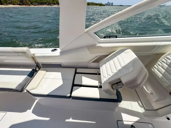  Yacht Photos Pics 2025 Edgewater 262 CX boat interior with white seating and ocean view.