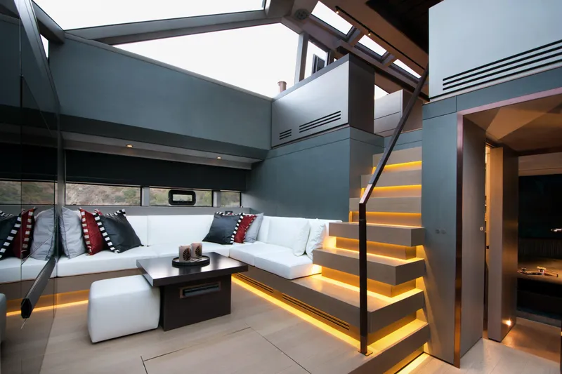  Yacht Photos Pics Luxurious interior of 2025 Mazu Yachts Mazu 82 with modern seating and illuminated stairs.