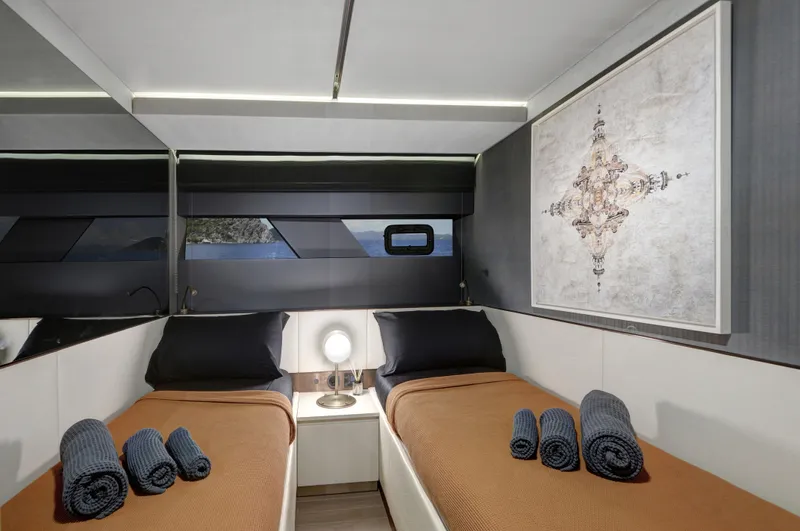  Yacht Photos Pics Luxurious twin cabin interior of 2025 Mazu 82 yacht with modern decor and amenities.