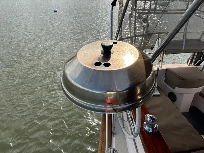 Andante Yacht Photos Pics Stainless steel grill on 1995 Island Packet 37 sailboat deck, overlooking water.