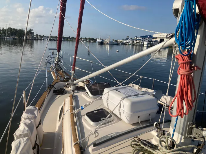 Andante Yacht Photos Pics Sailboat deck view of 1995 Island Packet 37 in a calm marina setting.