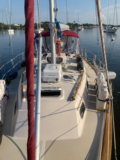 Andante Yacht Photos Pics 1995 Island Packet 37 sailboat on calm water, featuring deck and rigging details.