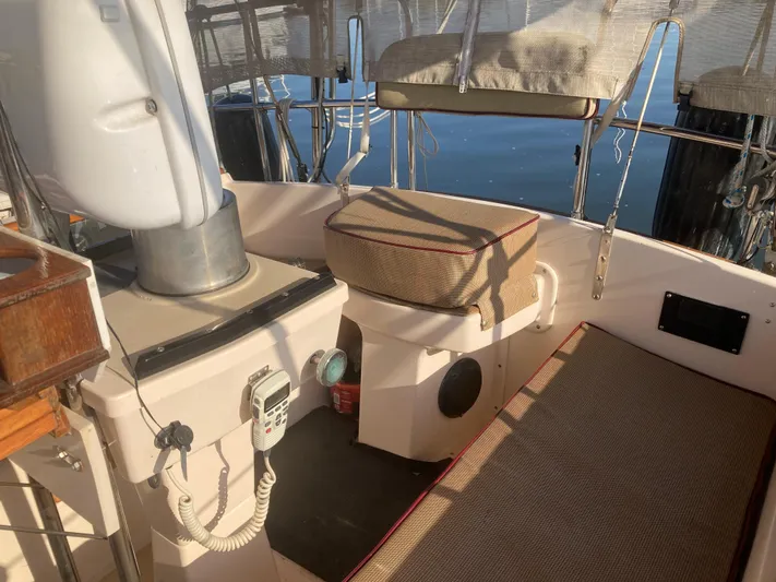 Andante Yacht Photos Pics 1995 Island Packet 37 sailboat cockpit with seating and navigation equipment.