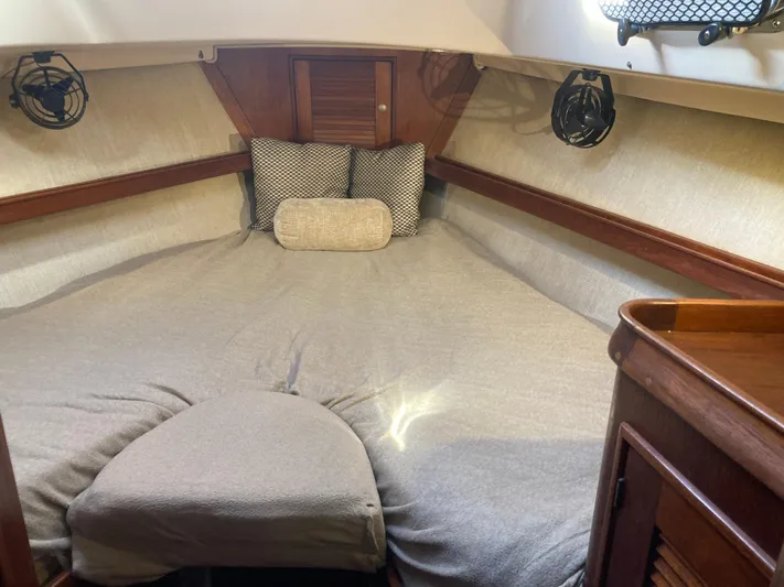 Andante Yacht Photos Pics Cozy cabin interior of a 1995 Island Packet 37 sailboat with a comfortable bed.