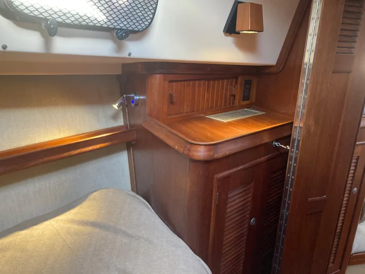 Andante Yacht Photos Pics 1995 Island Packet 37 interior cabin with wooden cabinetry and cozy sleeping area.