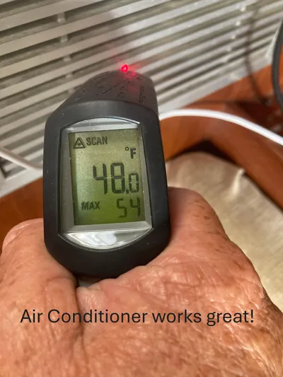 Andante Yacht Photos Pics Infrared thermometer showing 48°F, indicating effective air conditioning on Island Packet 37 yacht.