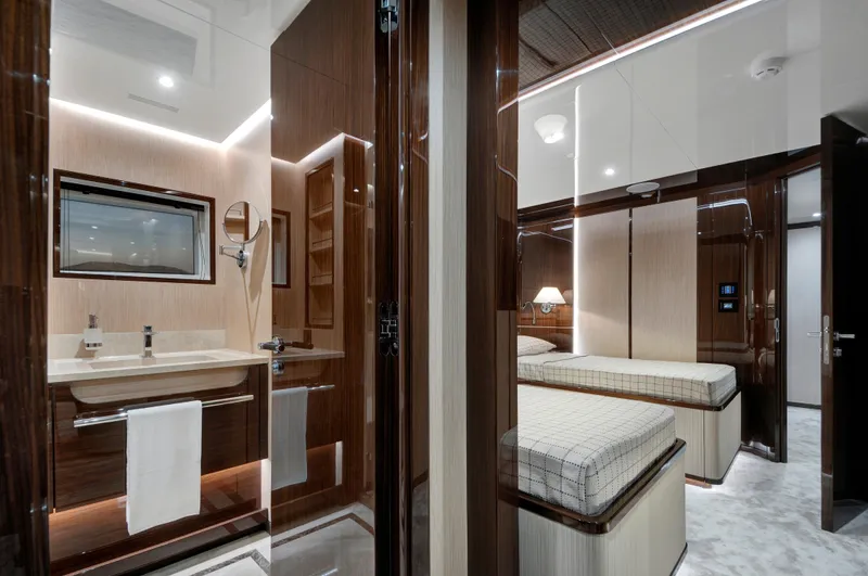 Lazzara Uhv 100 Yacht Photos Pics Luxurious interior of 2026 Lazzara UVH 100 yacht featuring bedroom and bathroom.