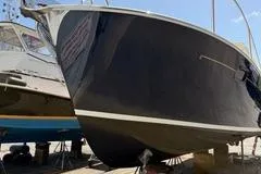 Joy! Yacht Photos Pics 2005 MJM 34z Downeast boat on dry dock, side view.