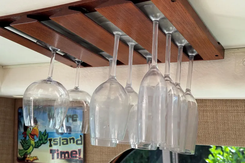 Renegade Yacht Photos Pics Hanging wine glasses in a 2008 Cabo 35 Flybridge boat interior.