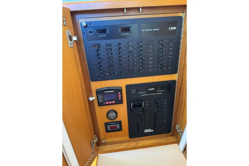 Renegade Yacht Photos Pics Electrical control panel inside 2008 Cabo 35 Flybridge boat, featuring AC and DC systems.