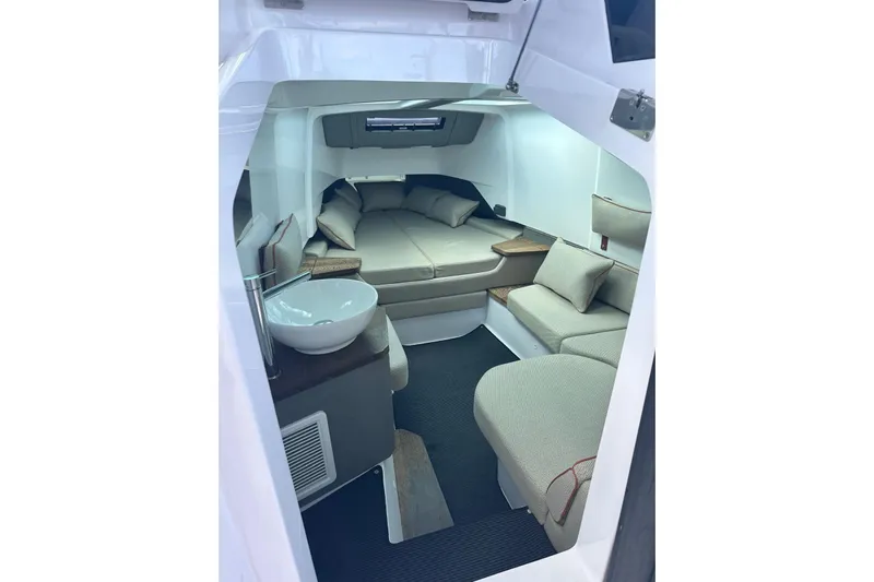  Yacht Photos Pics 2021 Axopar 37 Sun-Top cabin interior with cozy seating and modern design.