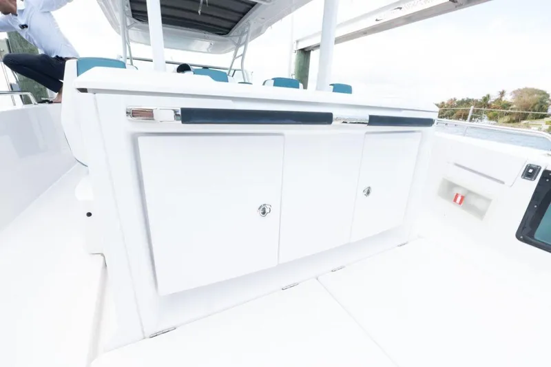  Yacht Photos Pics 2021 Axopar 37 Sun-Top boat interior with sleek white cabinetry and modern design.