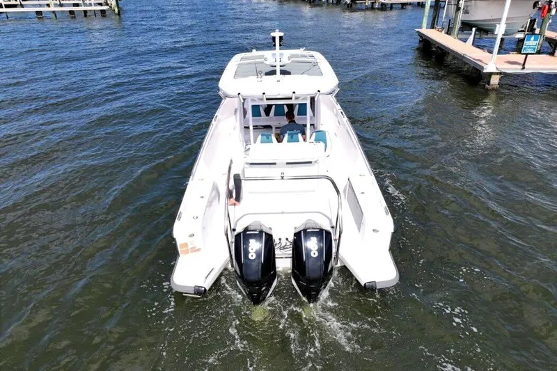  Yacht Photos Pics 2022 Axopar 37 Sun-Top boat with dual engines on the water.