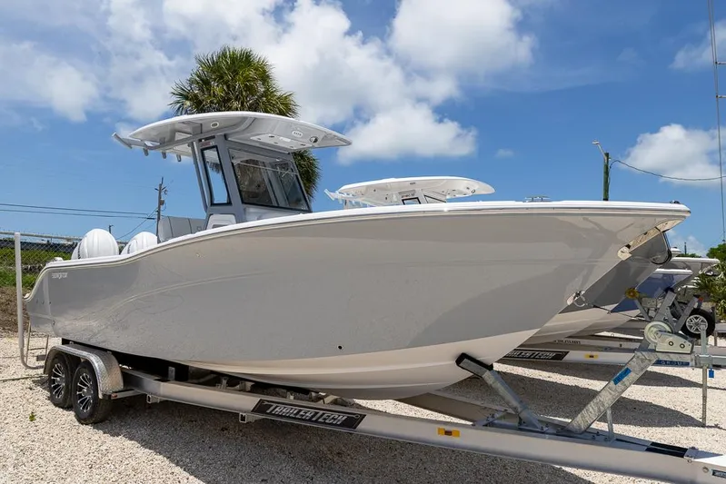  Yacht Photos Pics 2026 Sea Fox 268 Commander boat on trailer under clear blue sky.