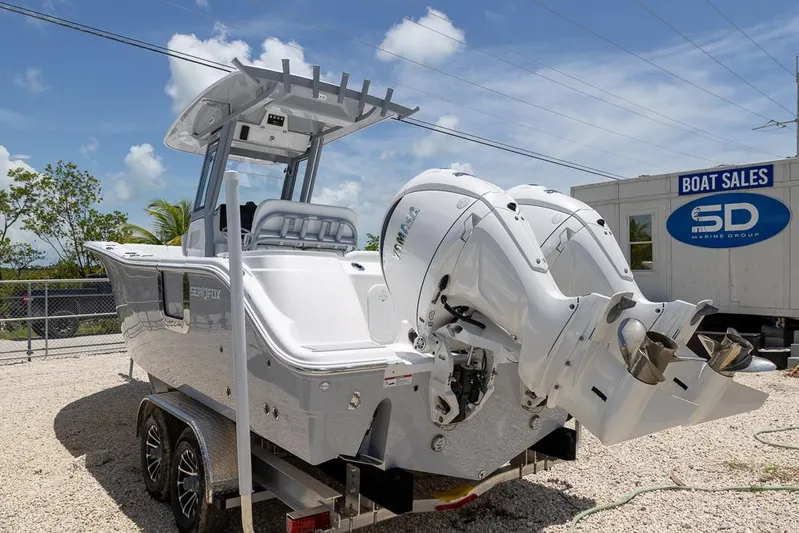  Yacht Photos Pics 2026 Sea Fox 268 Commander boat with dual engines on a trailer at a sales lot.