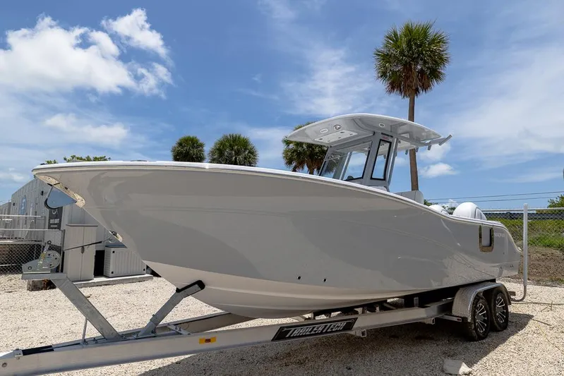  Yacht Photos Pics 2026 Sea Fox 268 Commander boat on trailer under clear blue sky.