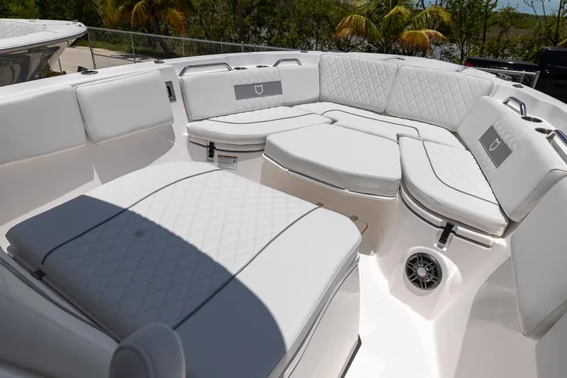  Yacht Photos Pics Luxurious seating on 2026 Sea Fox 268 Commander boat, featuring quilted white upholstery.