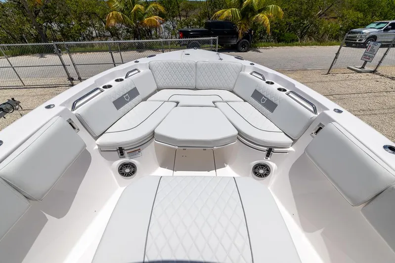  Yacht Photos Pics Luxurious seating area on 2026 Sea Fox 268 Commander boat, featuring white cushioned seats.