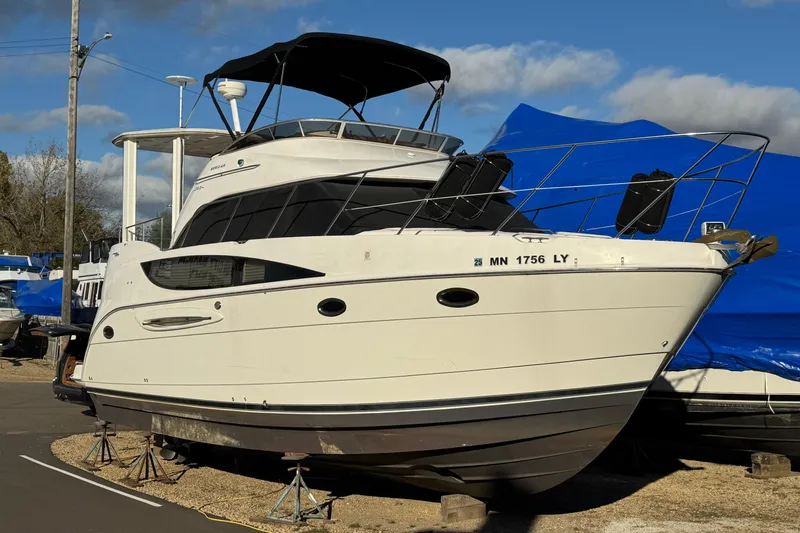 Comfort Zone Yacht Photos Pics 2005 Meridian 368 Motoryacht on stands, outdoor storage, clear sky background.
