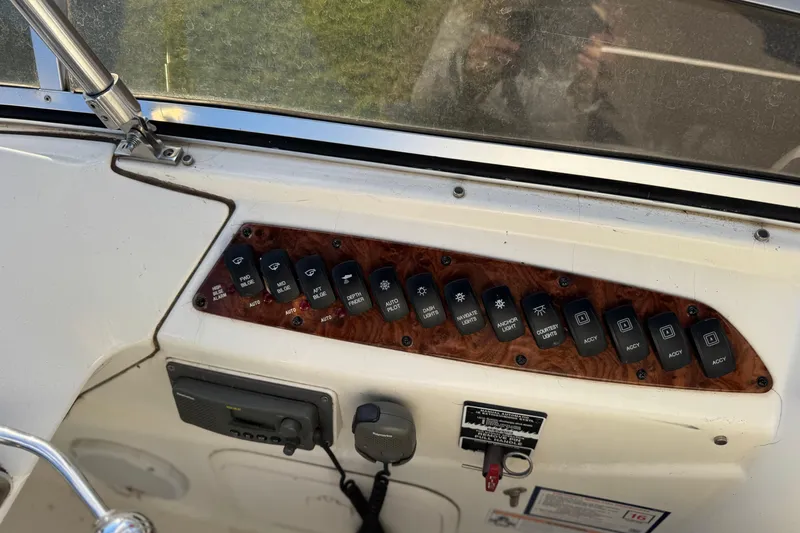 Comfort Zone Yacht Photos Pics Control panel of a 2005 Meridian 368 Motoryacht with various switches and buttons.