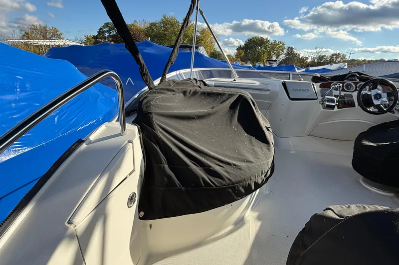 Comfort Zone Yacht Photos Pics 2005 Meridian 368 Motoryacht helm with covered seats and Garmin navigation system.