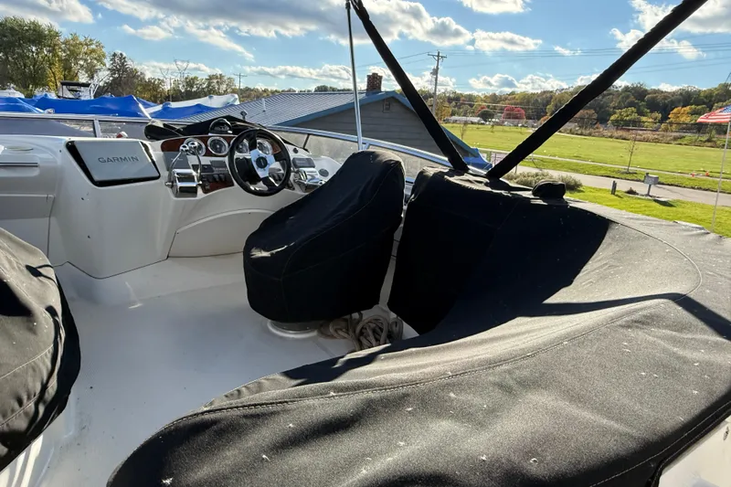 Comfort Zone Yacht Photos Pics 2005 Meridian 368 Motoryacht helm with covered seats and Garmin navigation system.