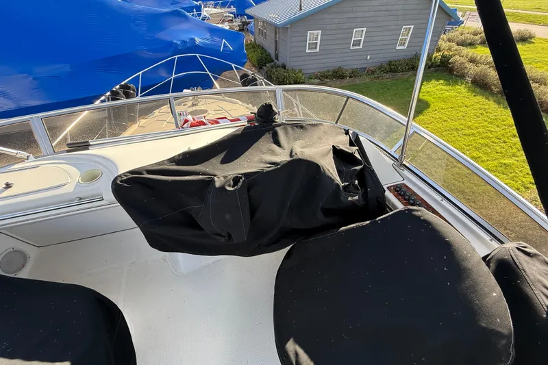 Comfort Zone Yacht Photos Pics 2005 Meridian 368 Motoryacht deck with covered seating and scenic marina view.