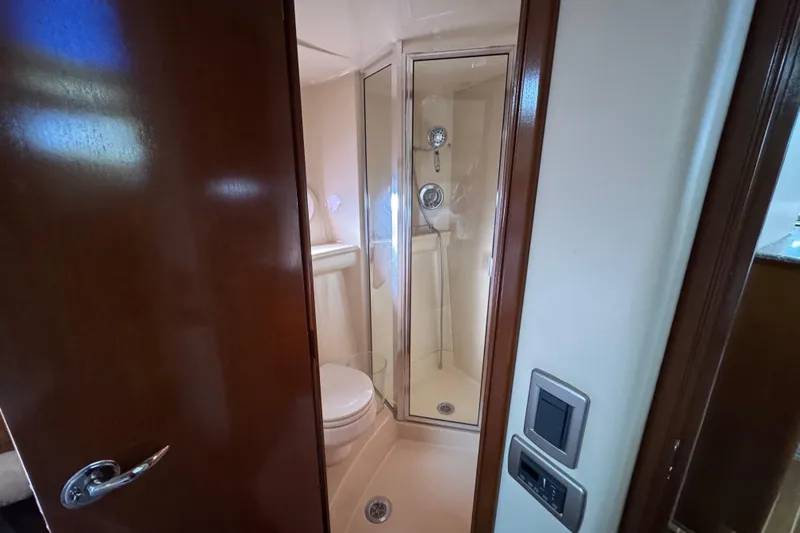 Comfort Zone Yacht Photos Pics Bathroom interior of 2005 Meridian 368 Motoryacht with shower and toilet.