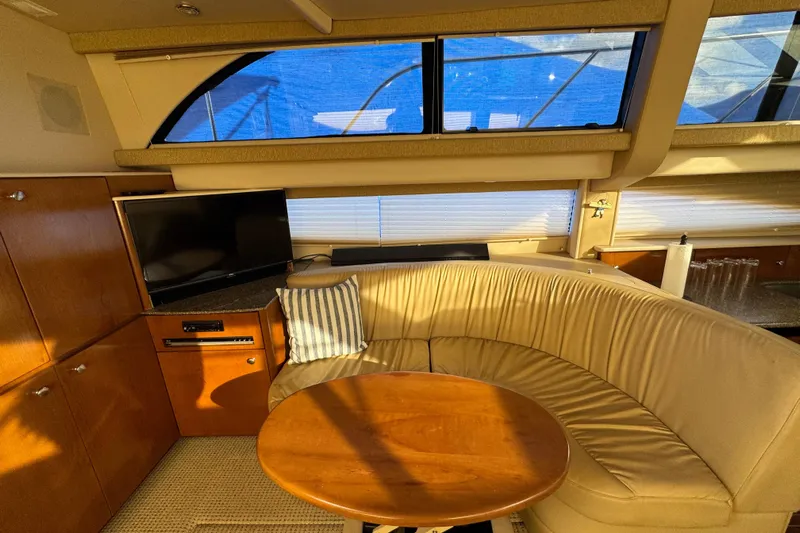 Comfort Zone Yacht Photos Pics Luxurious interior of 2005 Meridian 368 Motoryacht with cozy seating and TV.
