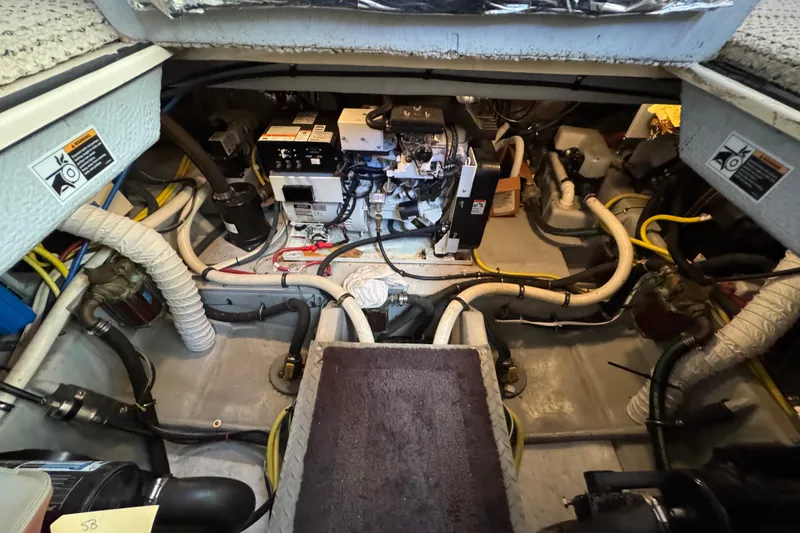 Comfort Zone Yacht Photos Pics Engine room of 2005 Meridian 368 Motoryacht with visible wiring and machinery.