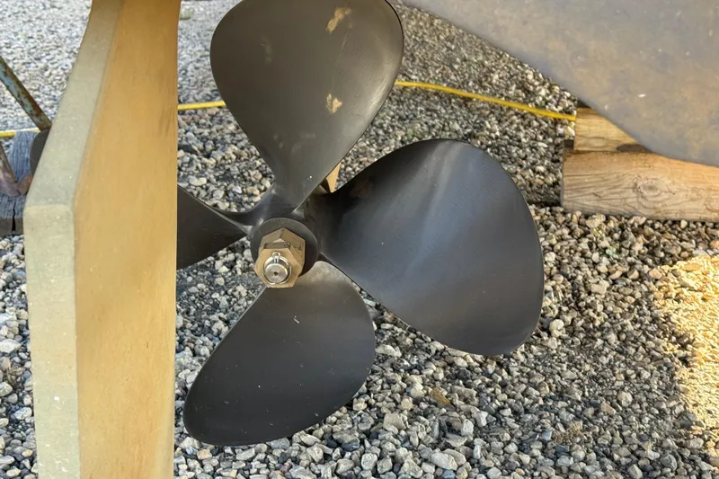 Comfort Zone Yacht Photos Pics Propeller of 2005 Meridian 368 Motoryacht on gravel surface.