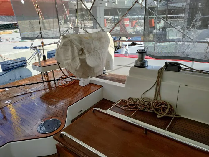 Felitsata II Yacht Photos Pics Hanse 62 DS 2011 yacht deck with wooden finish and covered steering wheel.