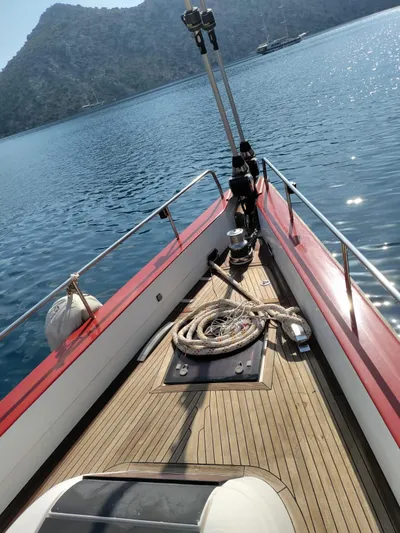 Felitsata II Yacht Photos Pics Hanse 62 DS yacht deck with ropes, calm sea, and mountainous backdrop.