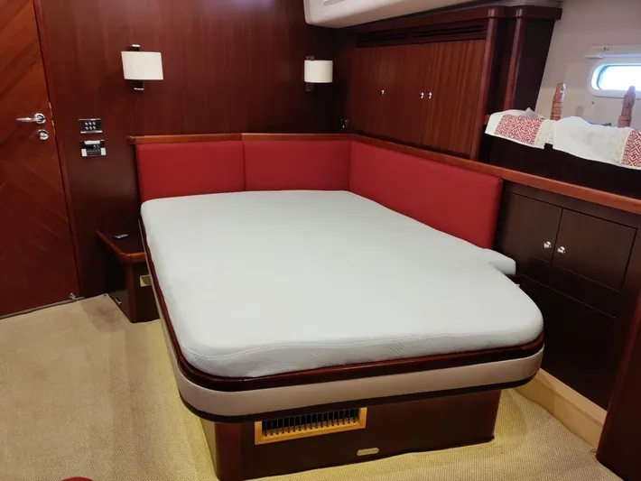 Felitsata II Yacht Photos Pics Luxurious cabin interior of 2011 Hanse 62 DS yacht with a comfortable bed.