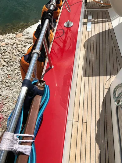 Felitsata II Yacht Photos Pics Deck of 2011 Hanse 62 DS yacht with red accents and wooden flooring.
