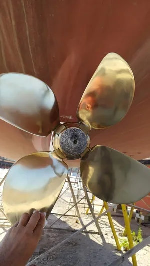 Felitsata II Yacht Photos Pics Close-up of a shiny propeller on a 2011 Hanse 62 DS yacht.