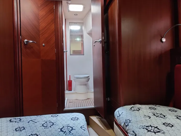 Felitsata II Yacht Photos Pics Interior of 2011 Hanse 62 DS yacht showing cabin and bathroom with wooden finish.