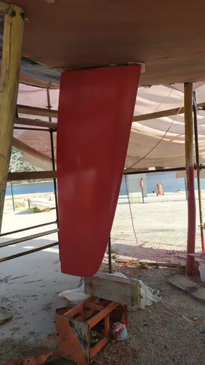 Felitsata II Yacht Photos Pics Red rudder of a 2011 Hanse 62 DS sailboat under maintenance.