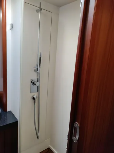 Felitsata II Yacht Photos Pics Shower area in 2011 Hanse 62 DS yacht with sleek wooden door.