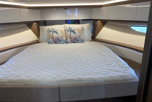  Yacht Photos Pics Luxurious cabin interior of 2022 Jeanneau Leader 46 yacht with elegant bedding.