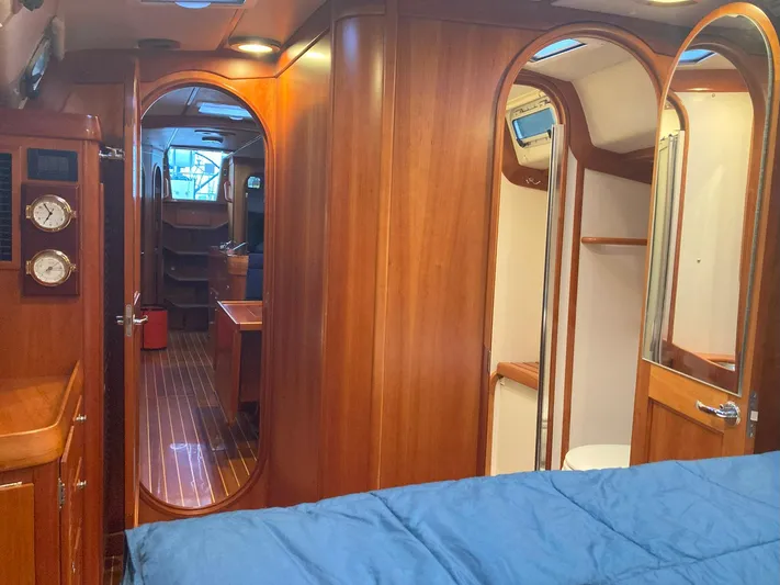 Harmony Yacht Photos Pics Luxurious 2005 Tillotson-Pearson J-160 yacht interior with wood finish and cozy cabin.