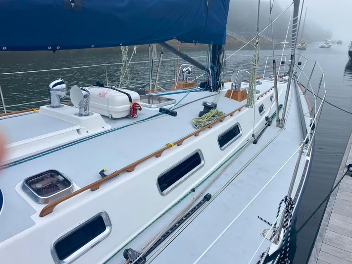 Harmony Yacht Photos Pics Sailboat docked, 2005 Tillotson-Pearson J-160, with blue sail cover and deck equipment.