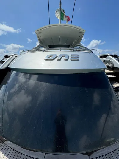  Yacht Photos Pics 2006 Pershing 56 yacht with "ONE" emblem, viewed from the stern under a clear sky.