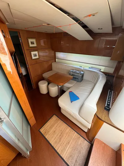  Yacht Photos Pics Interior of a 2006 Pershing 56 yacht with a cozy seating area.